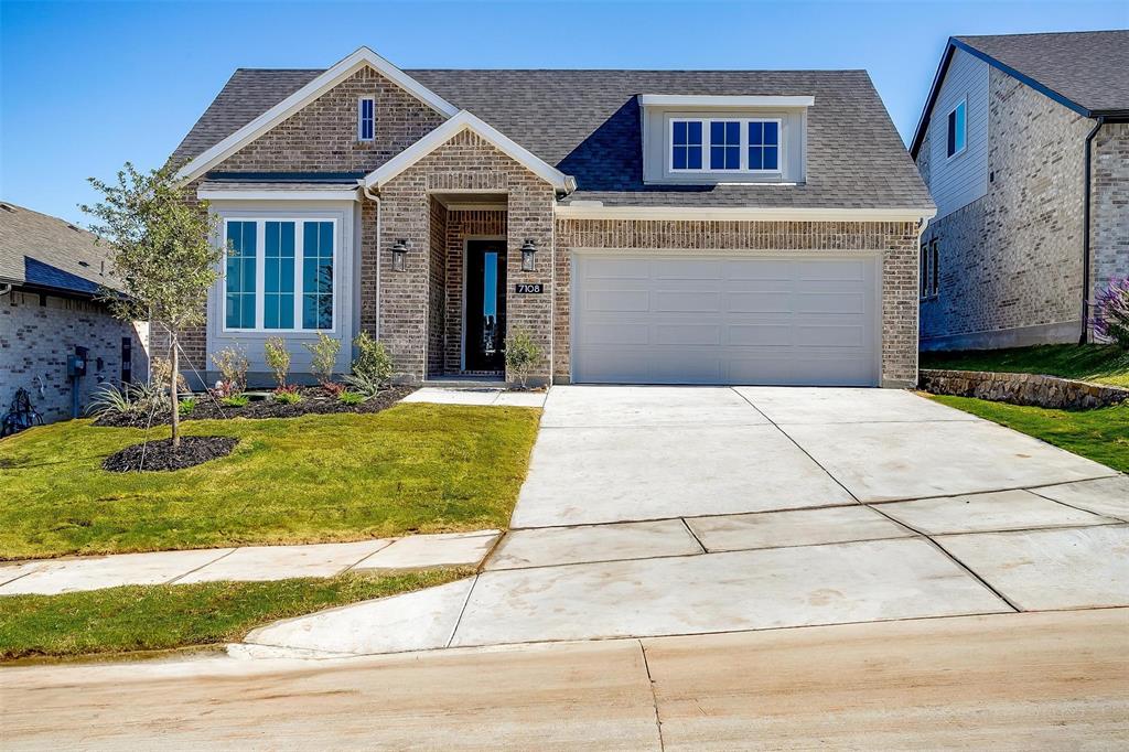 a front view of a house with yard