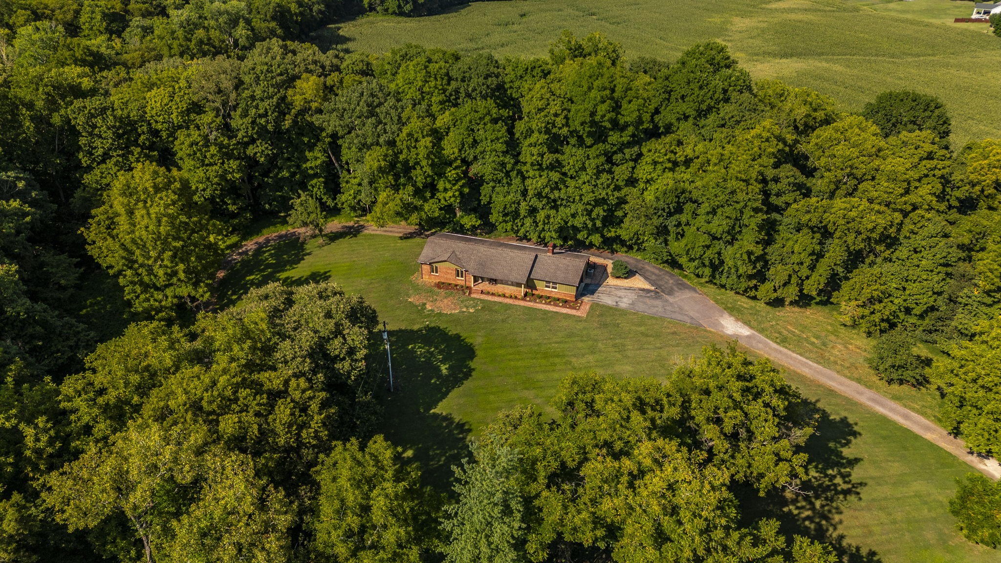 Nestled on 12.46 acres, this charming 1974 farmhouse offers a perfect blend of rustic character and modern comfort.