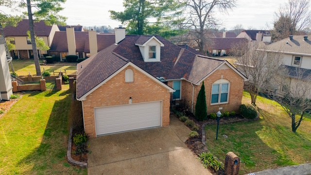 a aerial view of a house with a yard