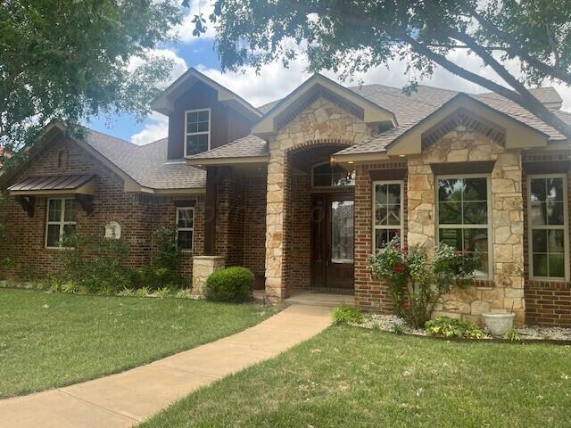 front view of a house with a yard