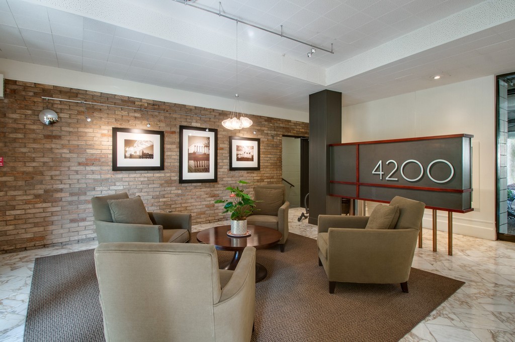 a living room with couches and a coffee table with wooden floor