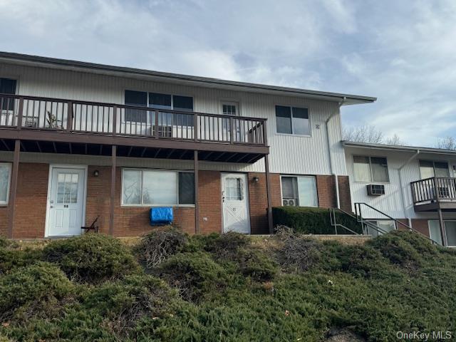 Back of property featuring a balcony