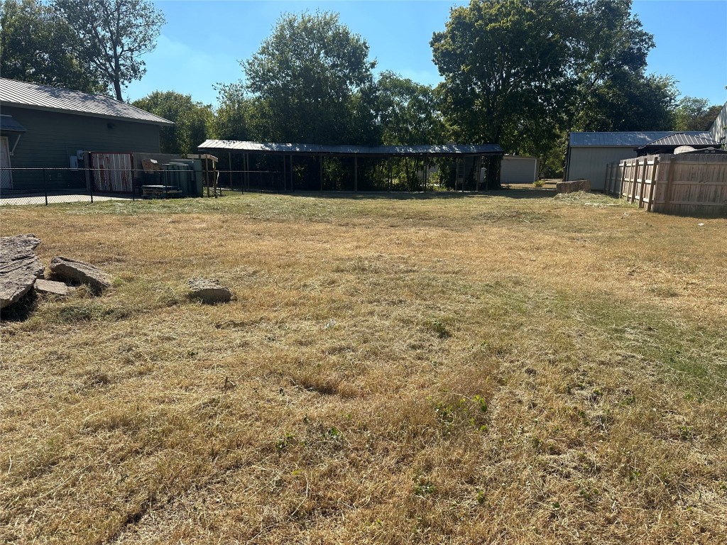 a backyard of a house with lots of green space