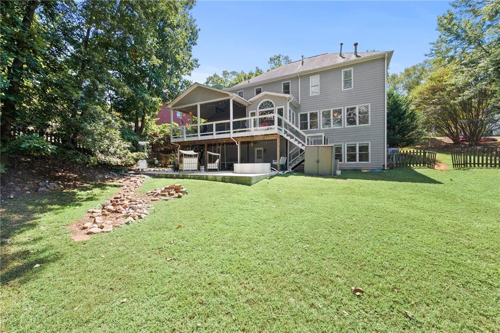 a view of a house with a yard balcony