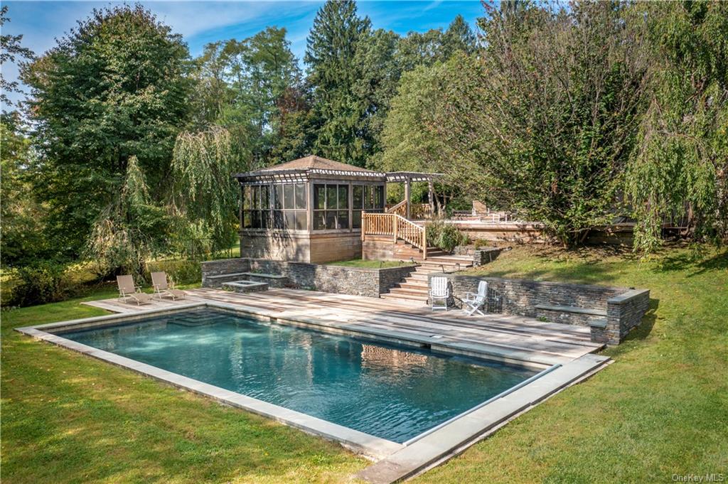 a view of a swimming pool with a patio