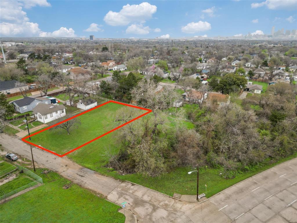 an aerial view of residential houses with outdoor space and garden