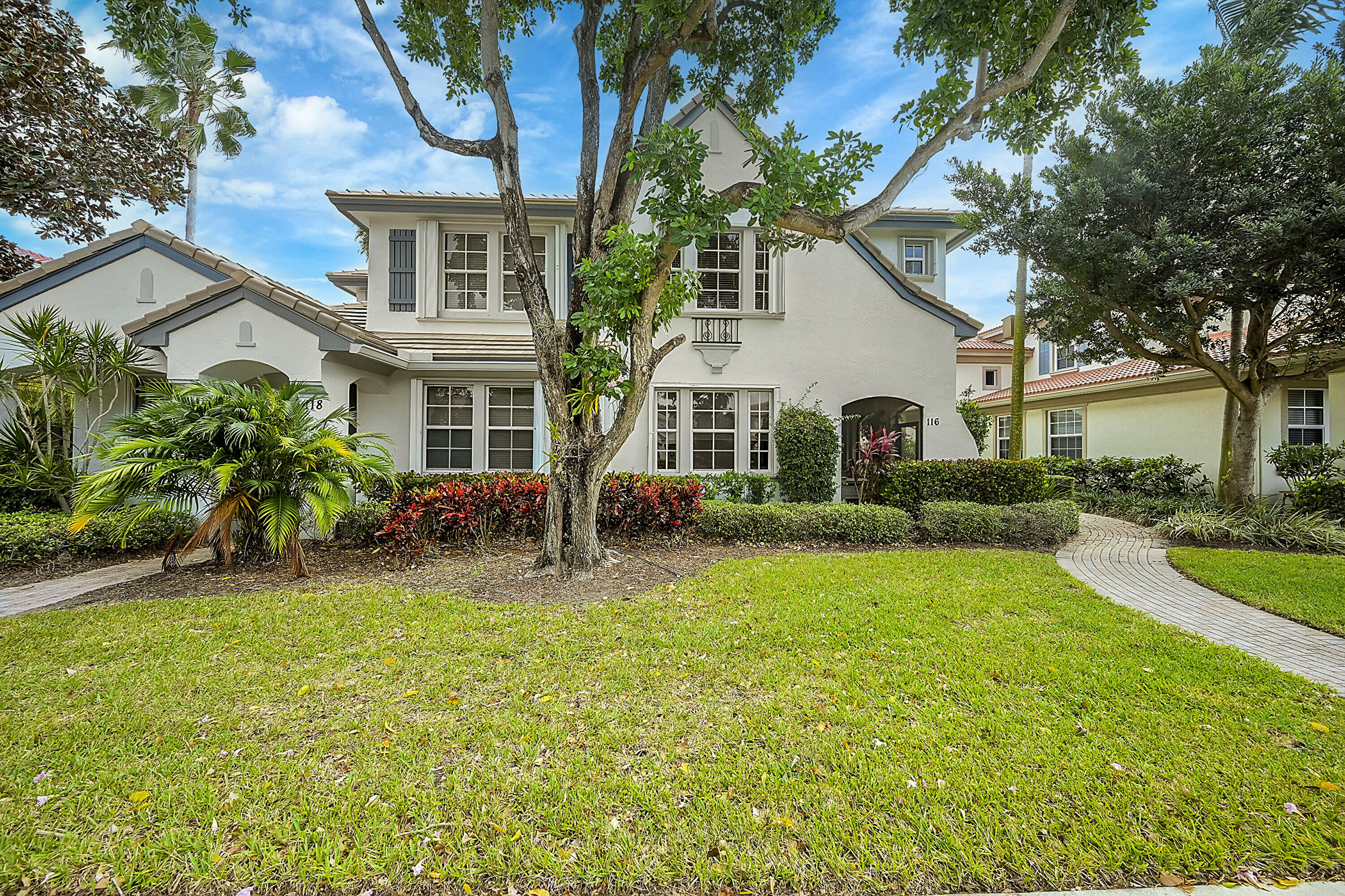 front view of a house with a yard