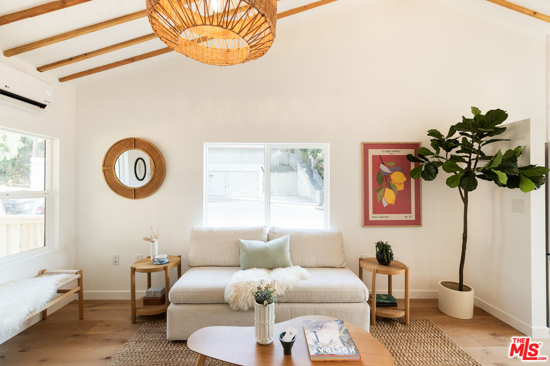 a living room with furniture and a window