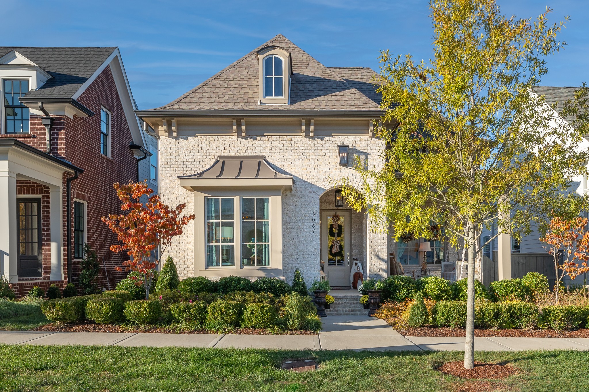 front view of a house with a yard