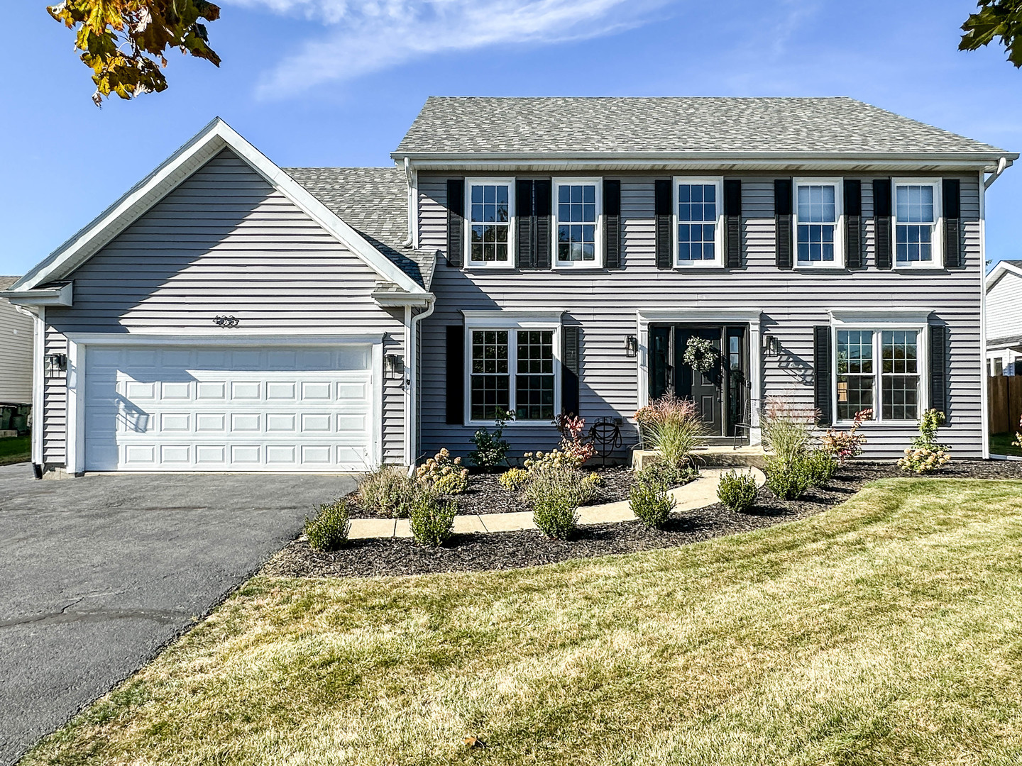 a front view of house with outdoor seating