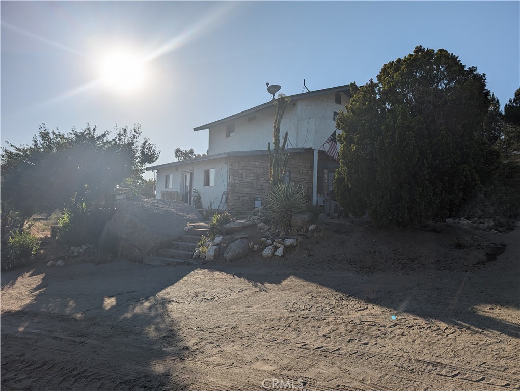 a view of a backyard of a house