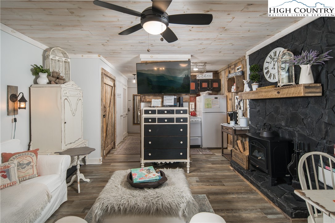 a kitchen with stainless steel appliances granite countertop a stove and a wooden floors