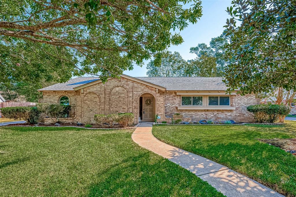 Welcome home to this charming one  story at 12622  Pine Bough Dr in the quaint Enchanted Valley community!