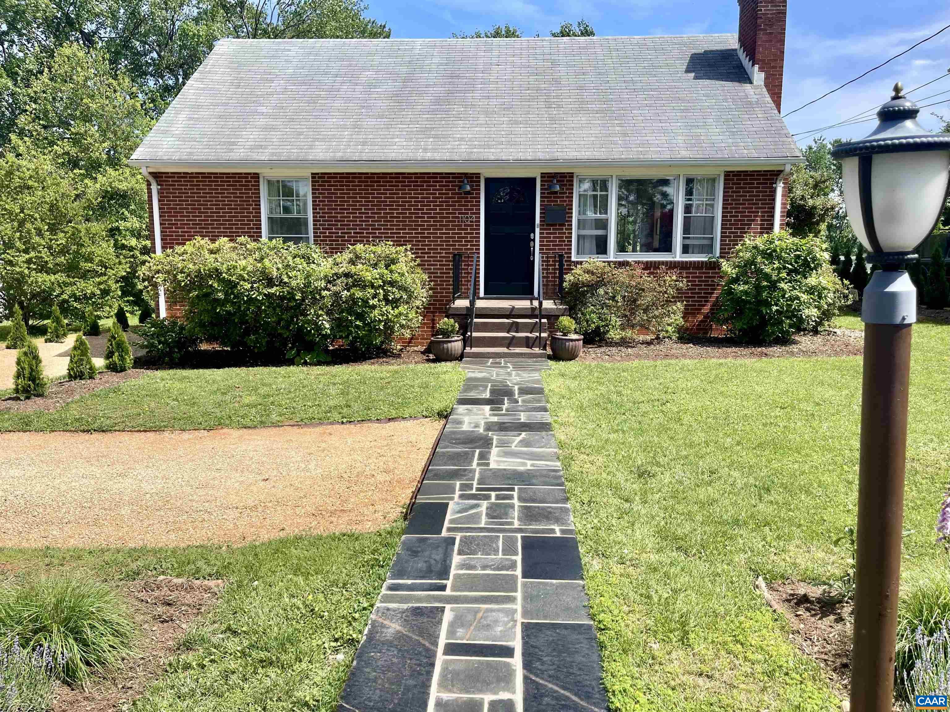 a front view of a house with yard