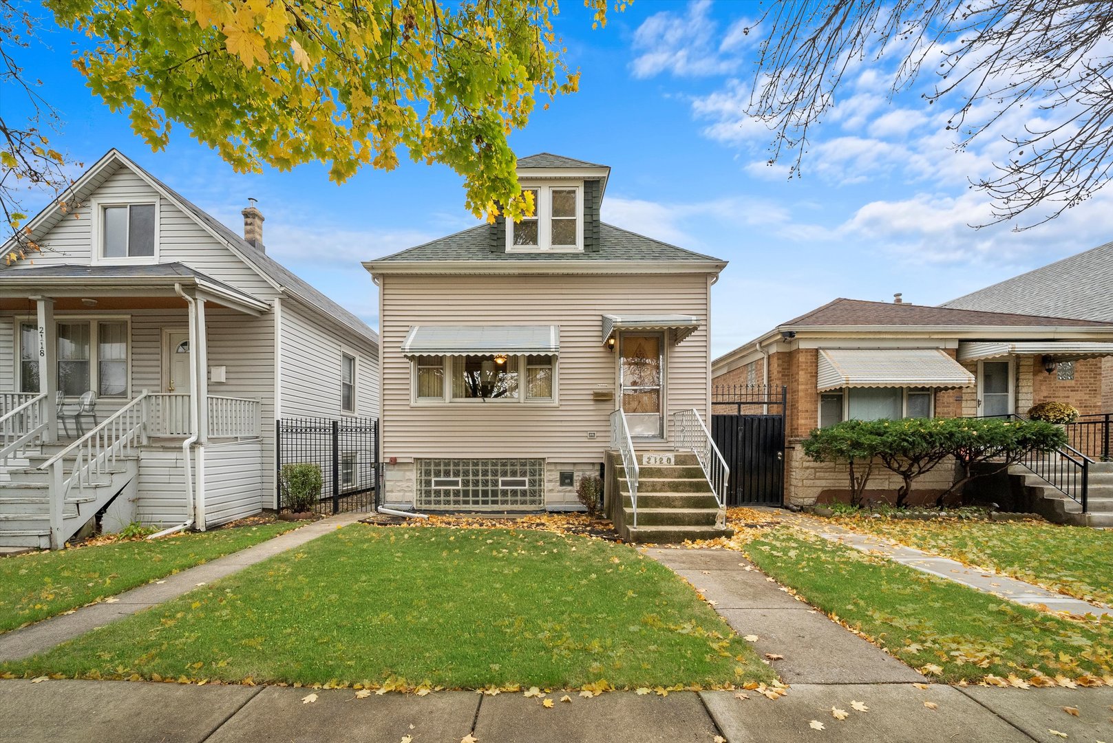 a front view of a house with a yard