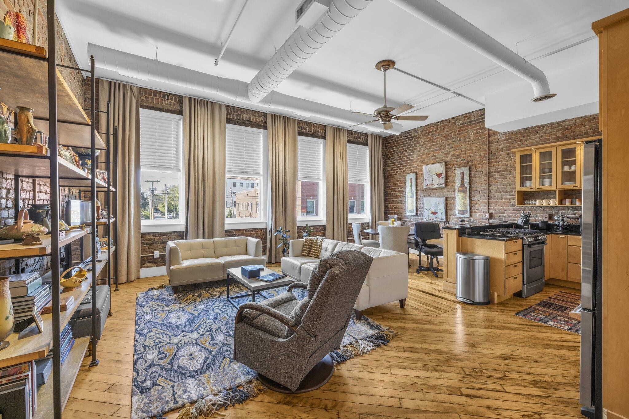 a living room with furniture or couch and a chandelier