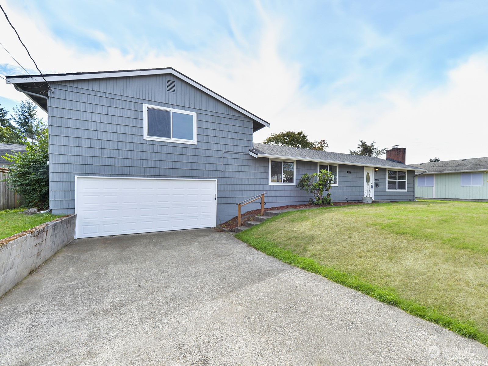 front view of a house with a yard