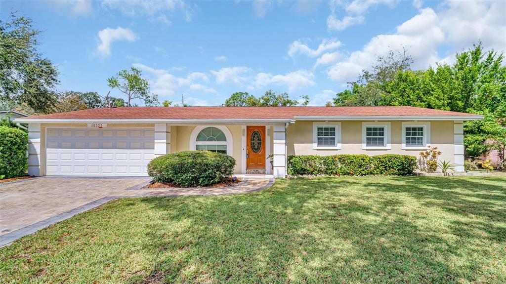 front view of a house with a yard