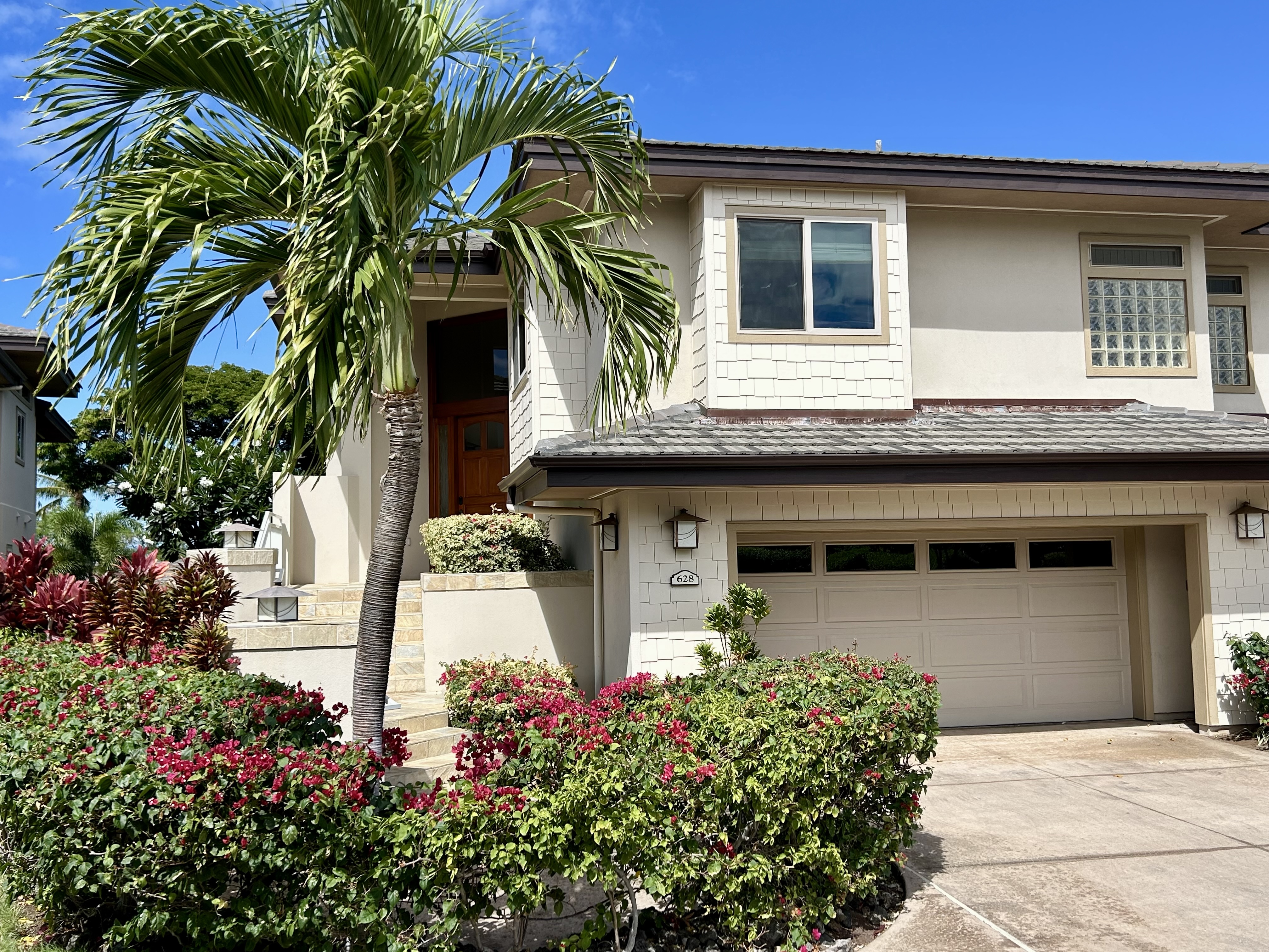 a front view of a house with a garage