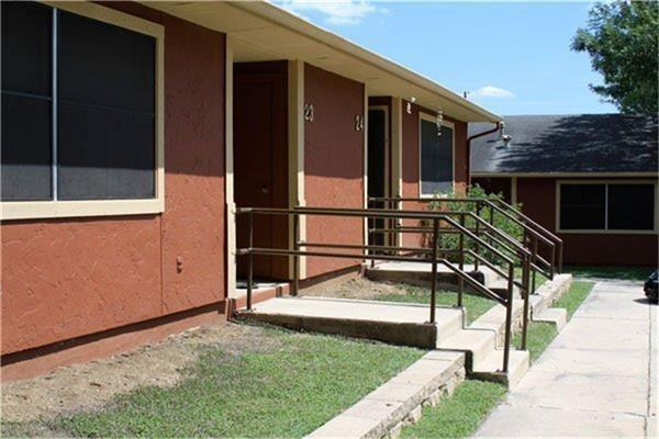 a view of house with backyard and patio