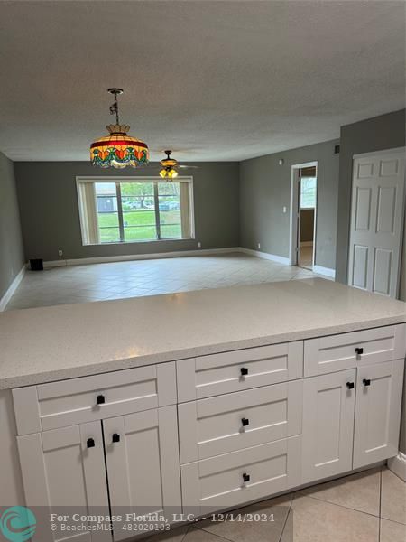 a view of kitchen with cabinets