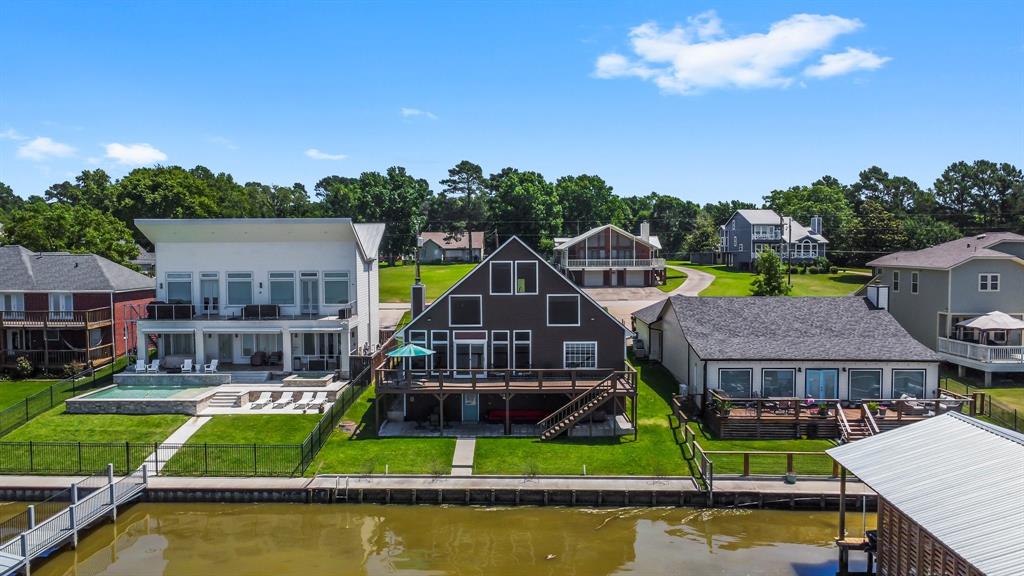 an aerial view of house with swimming pool and outdoor space