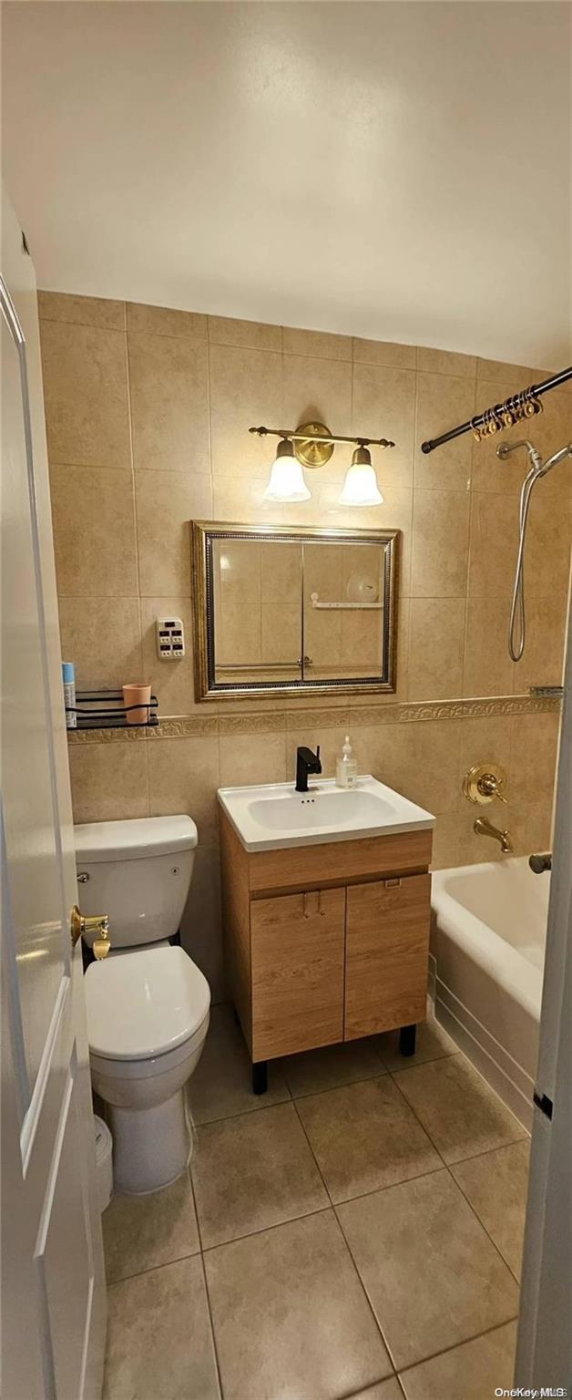 a bathroom with a sink a toilet and bathtub