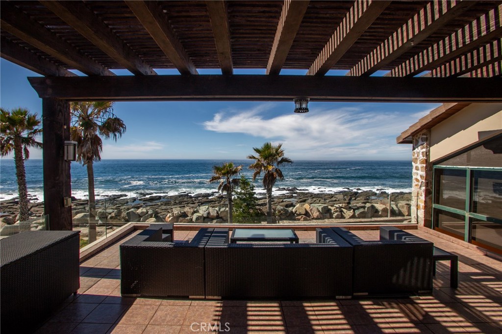 a view of a balcony with an ocean view