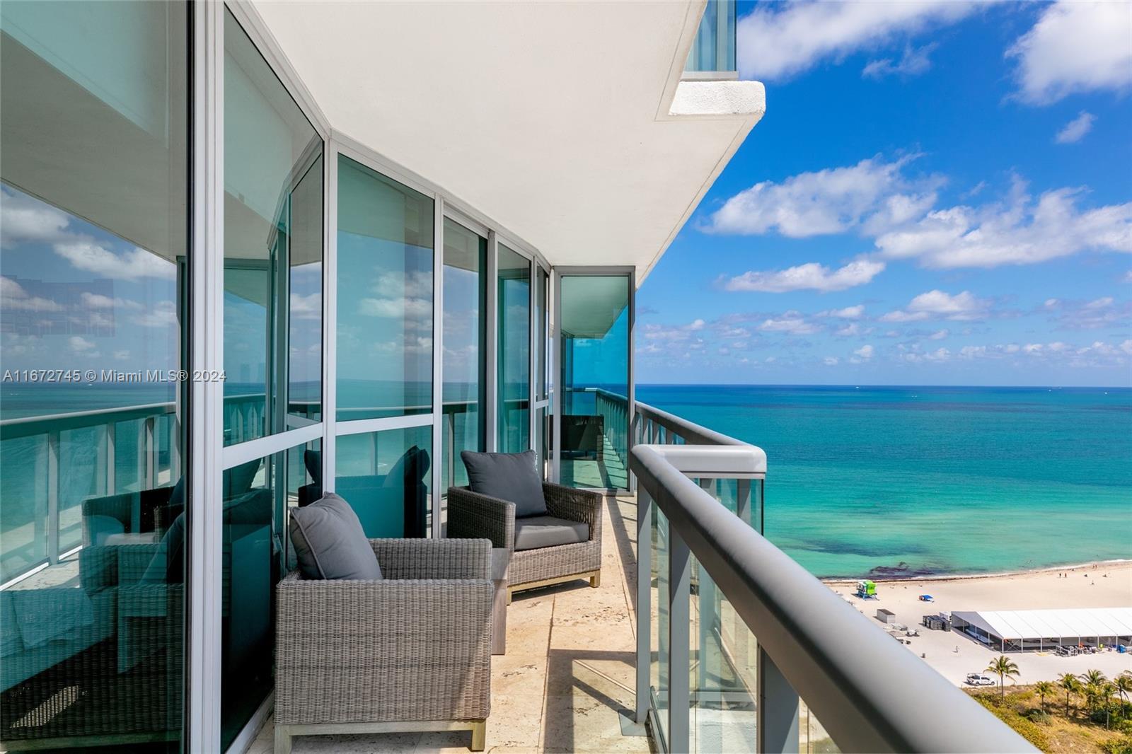 a balcony with view of outdoor space