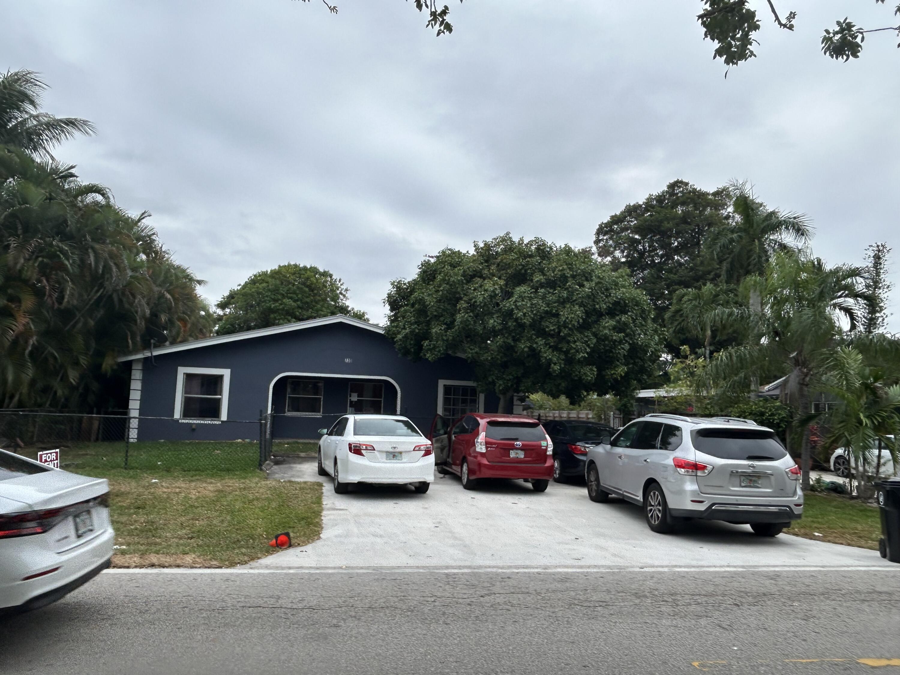 a view of a car parked in front of a house