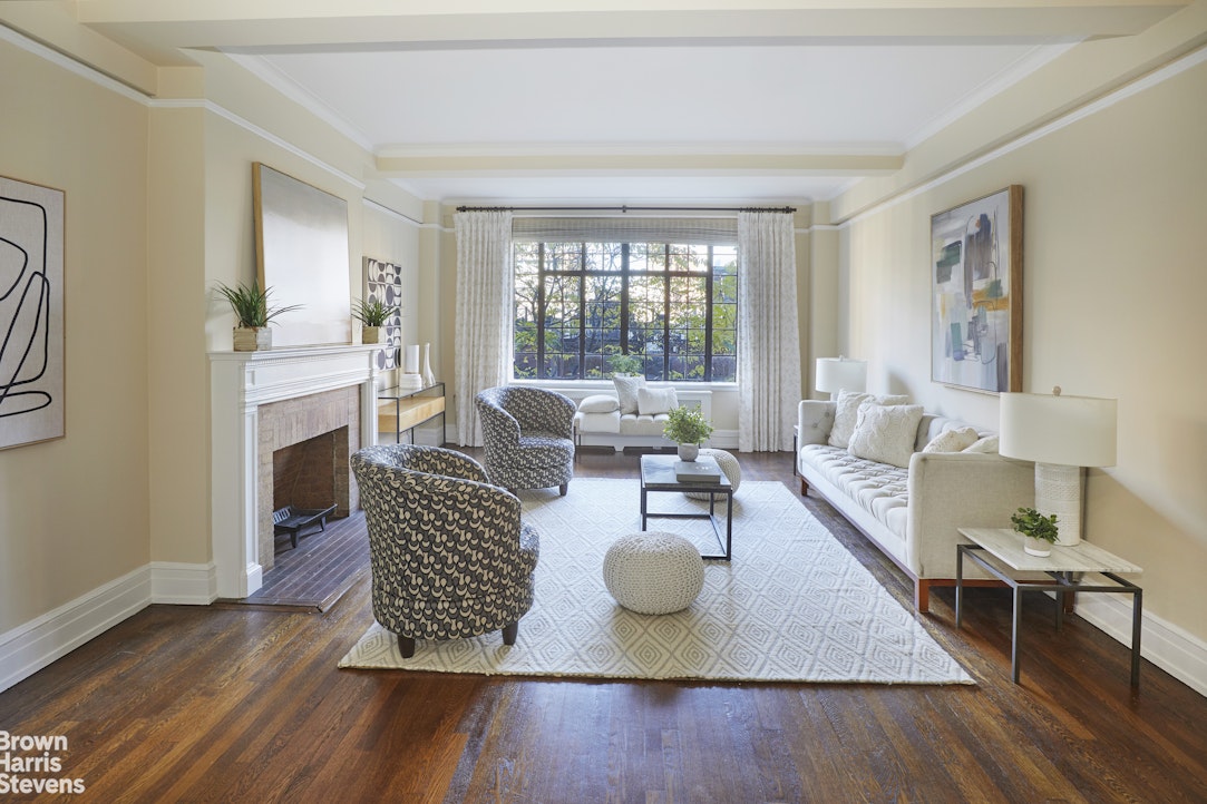 a living room with furniture rug and window