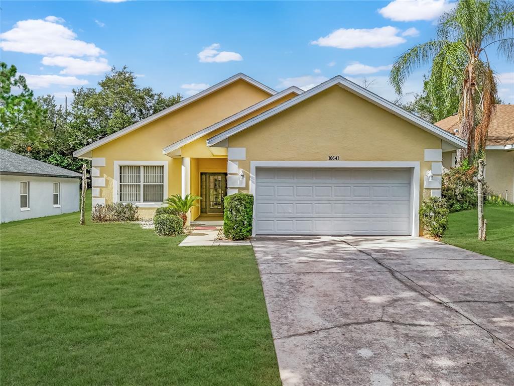 a view of a house with a yard