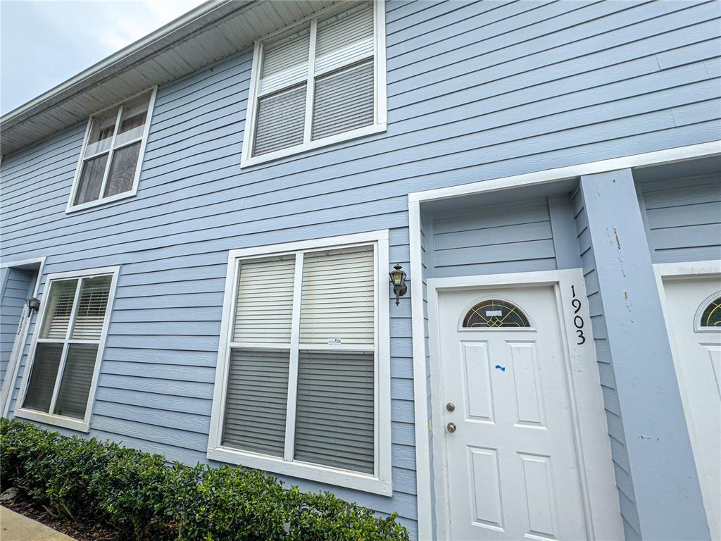 a side view of a house with a door