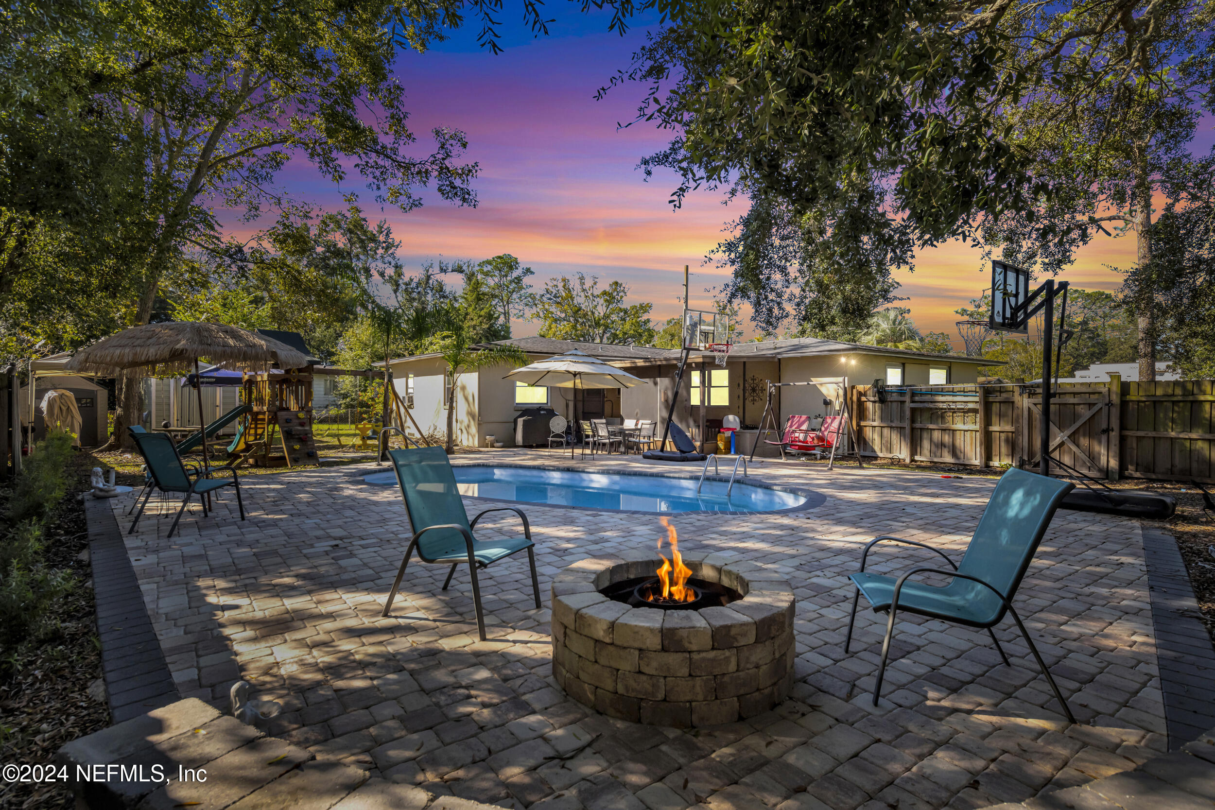 a view of a swimming pool with sitting area