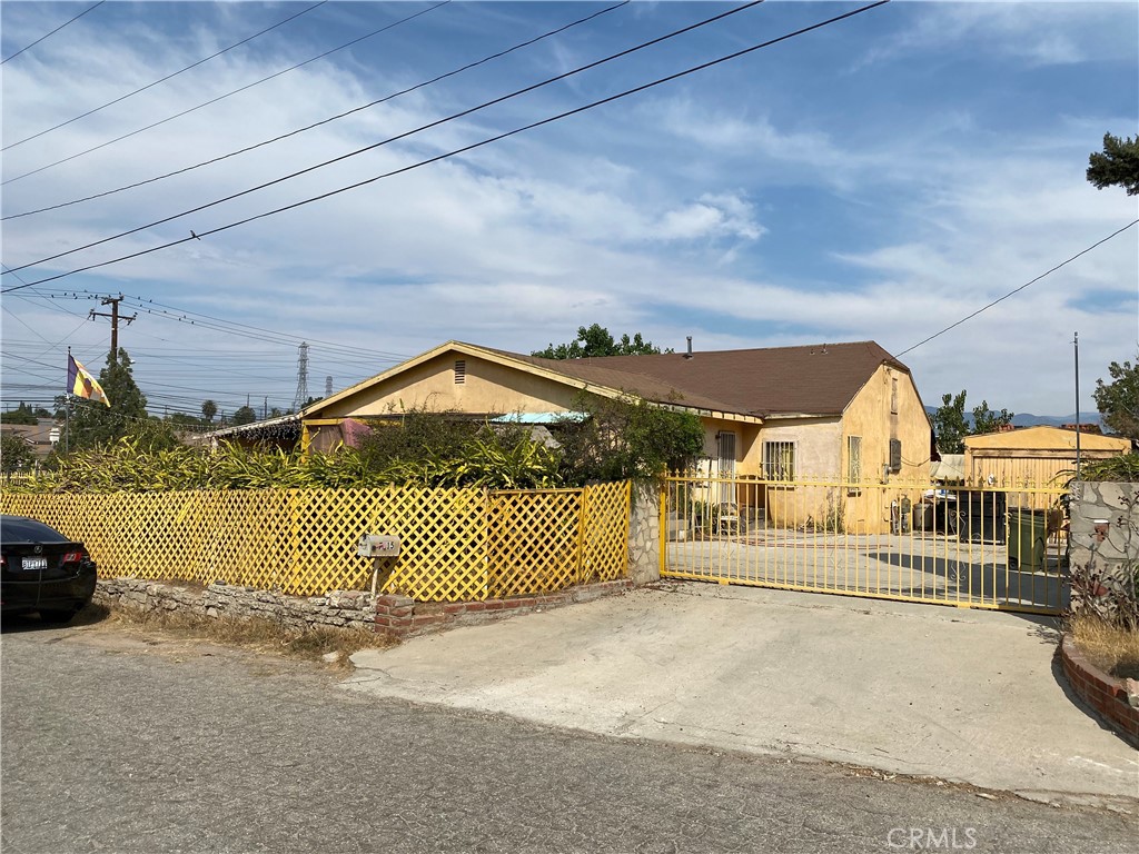 a view of a wrought iron fences in front of house