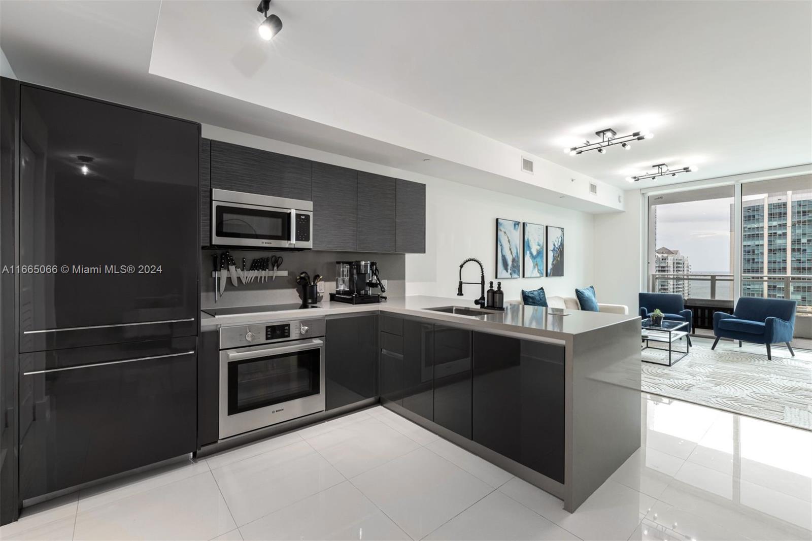 a kitchen with cabinets and stainless steel appliances