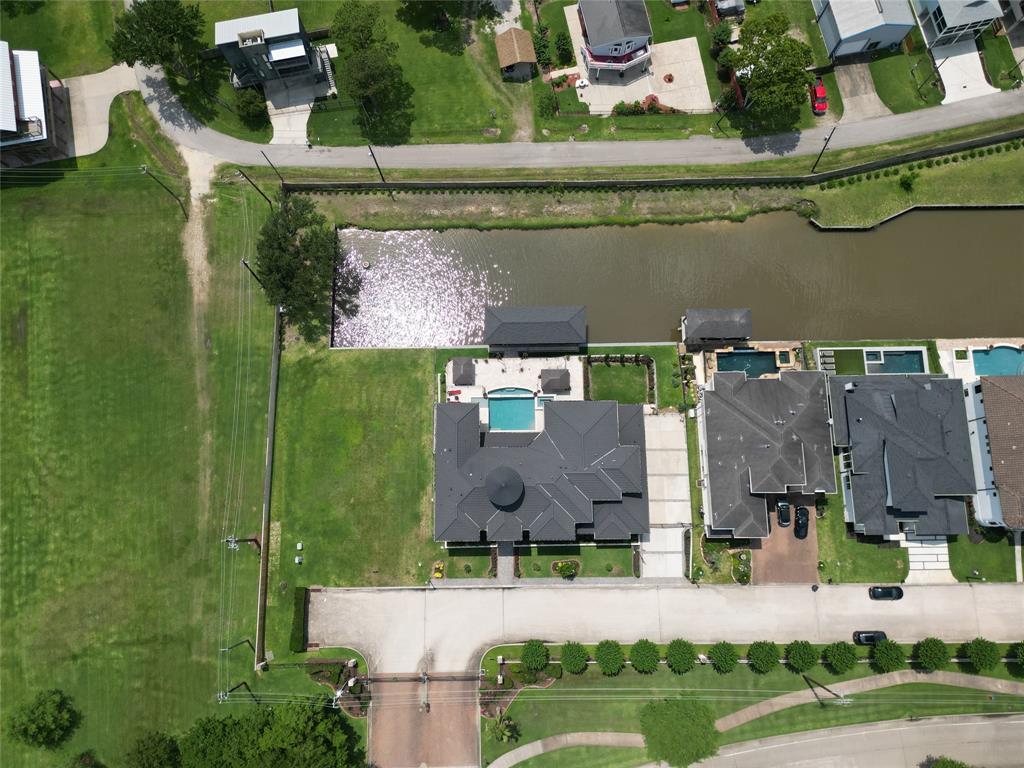 an aerial view of a house with a garden and a yard