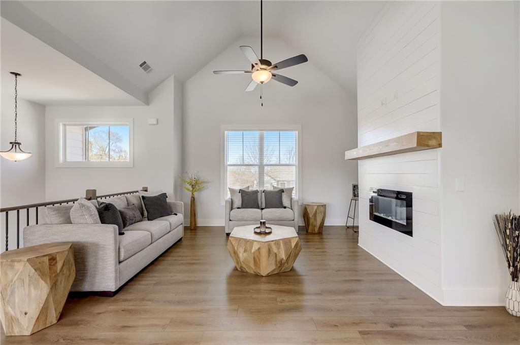 a living room with furniture and fireplace