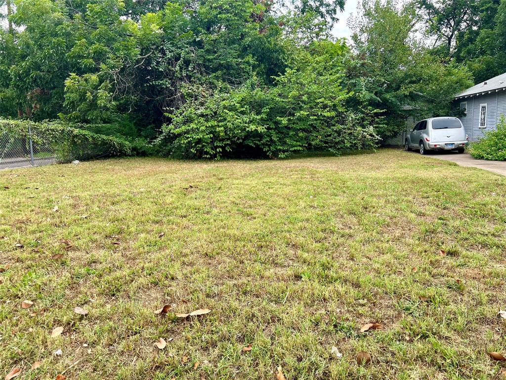 a view of a yard with an outdoor space