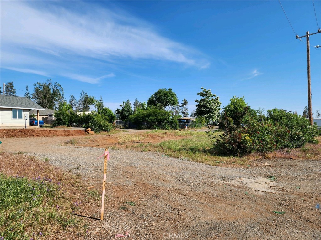 a view of road with view of a house