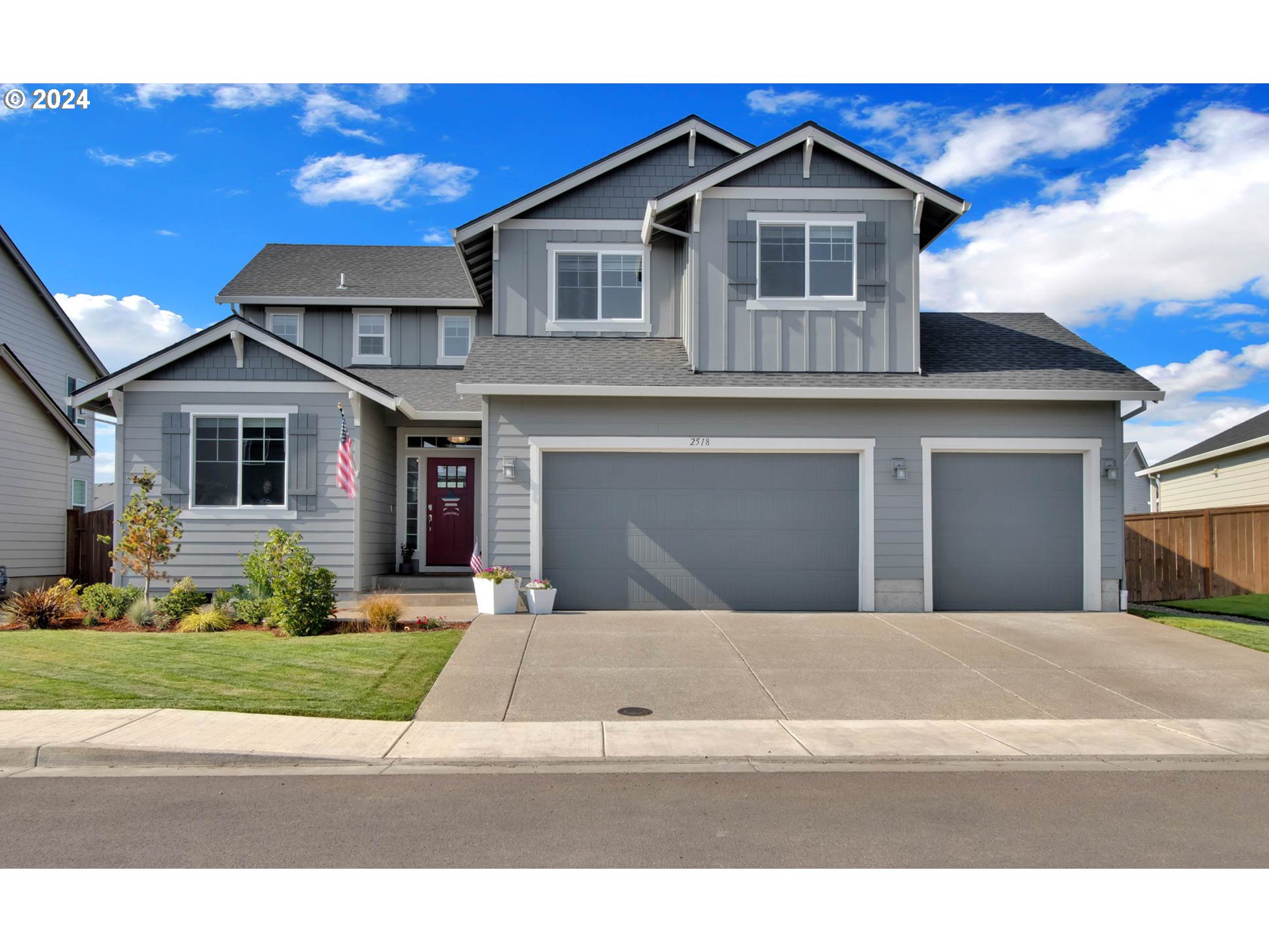 a front view of a house with a yard