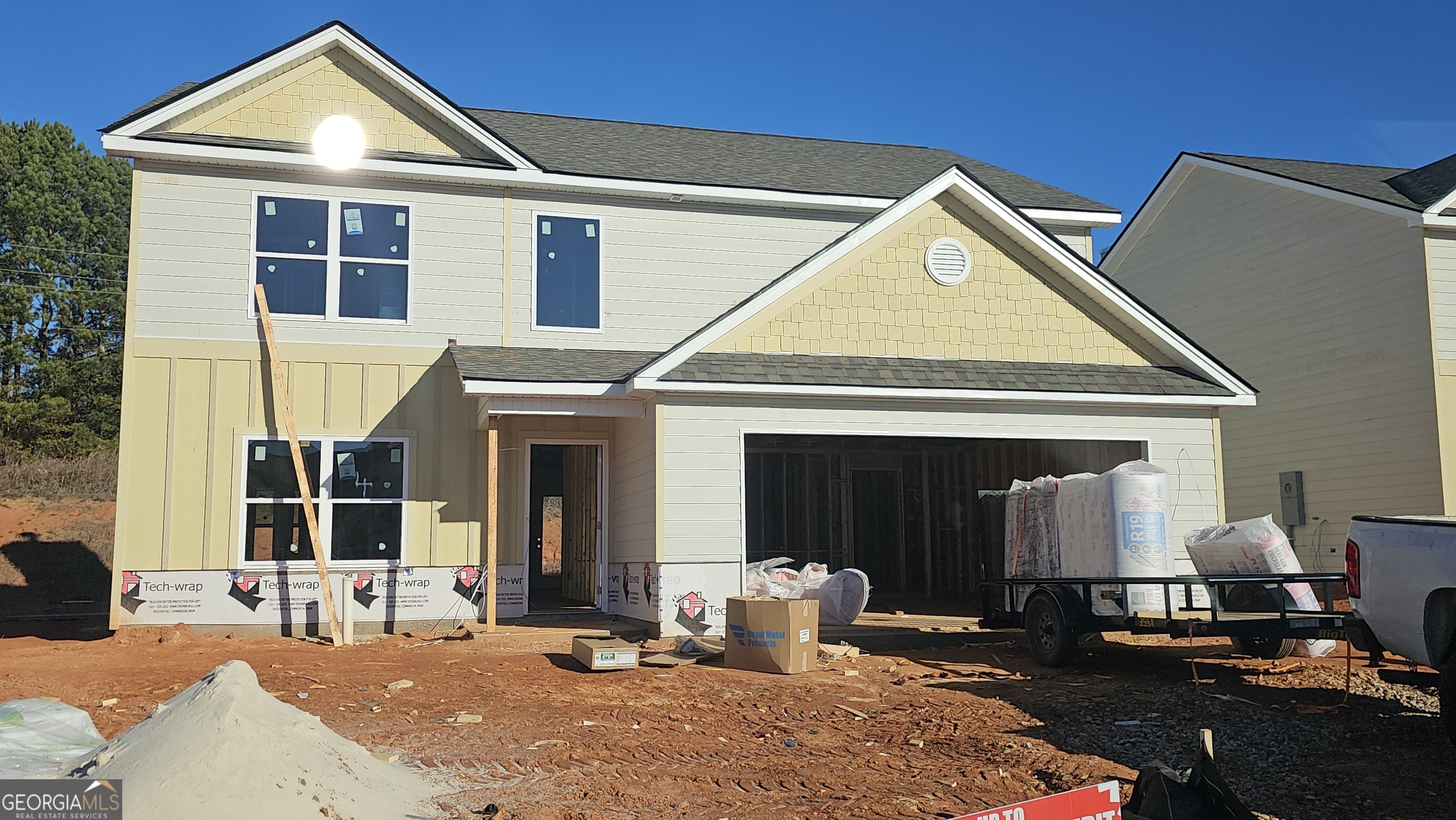 a view of a house with outdoor seating