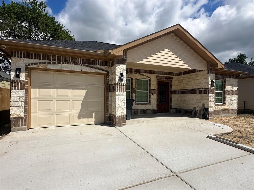 a front view of a house with a garage