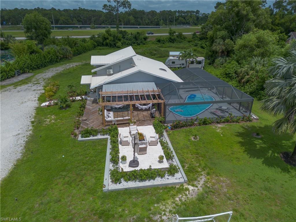 an aerial view of a house with a yard