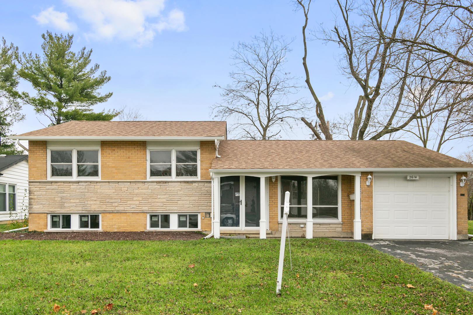 front view of a house with a yard