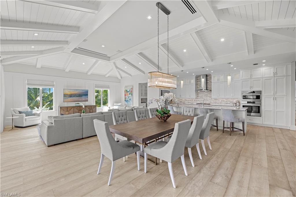 a dining room with furniture and wooden floor