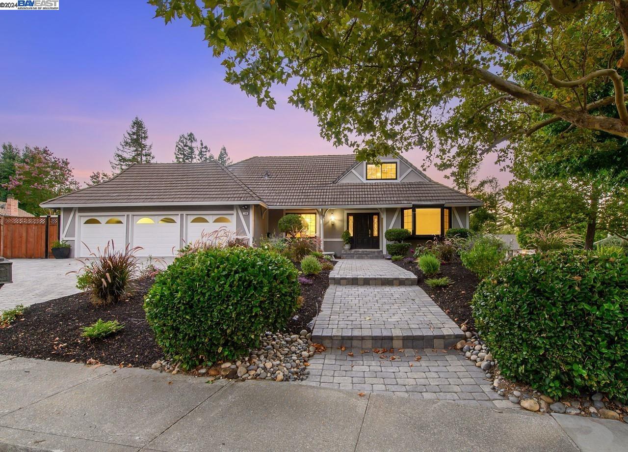 a front view of a house with yard