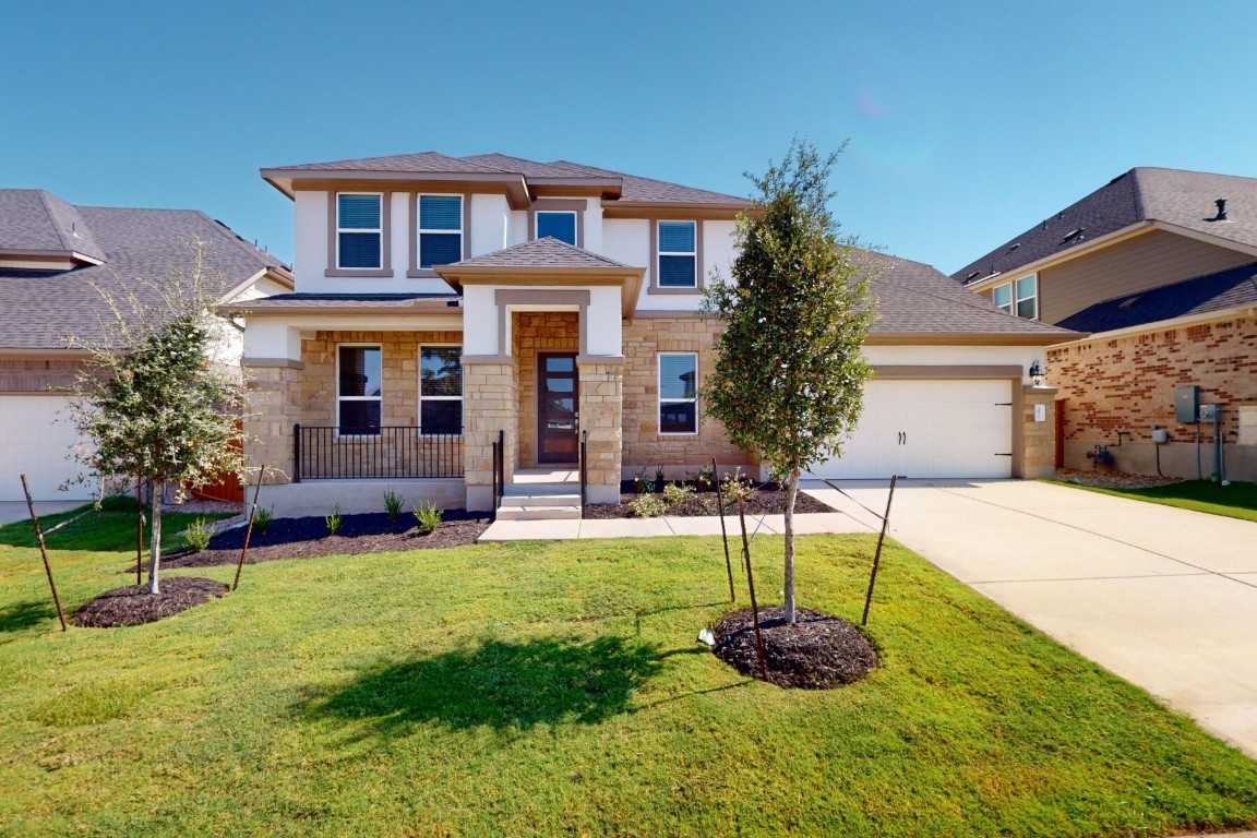 a front view of a house with a yard