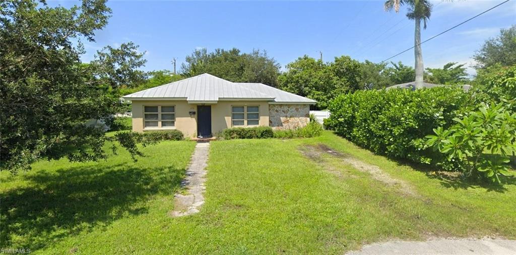 View of front of home with a front yard