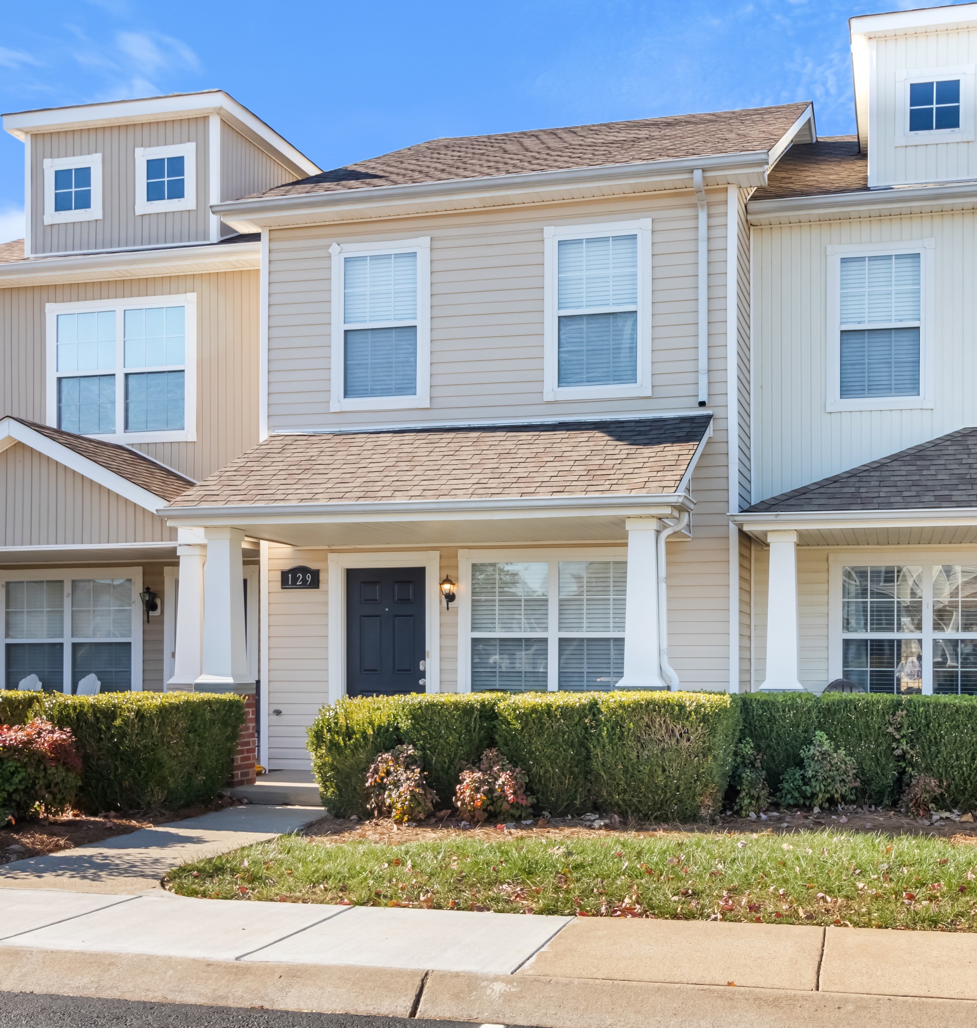 a front view of a house with a yard